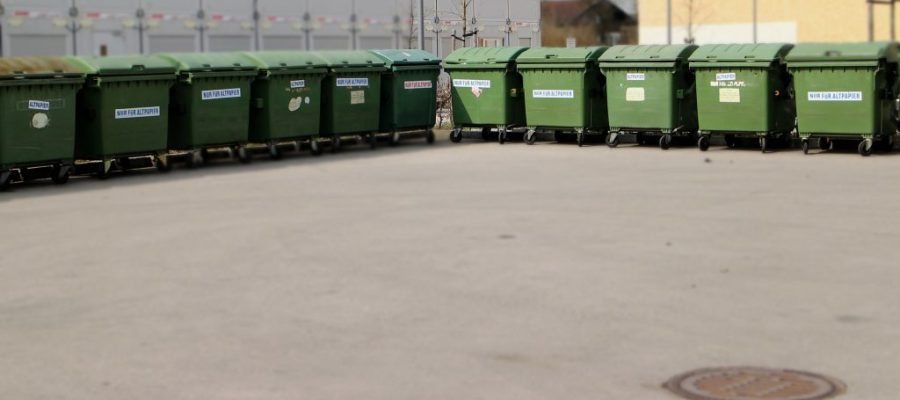 How can businesses implement an effective waste management plan